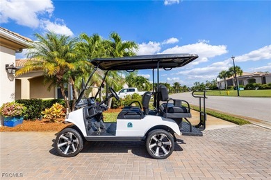 The stunning saltwater pool is the focal point of this exquisite on Pelican Preserve Golf Club in Florida - for sale on GolfHomes.com, golf home, golf lot