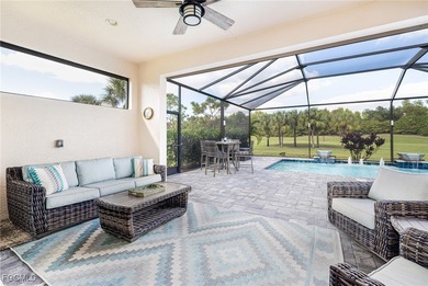 The stunning saltwater pool is the focal point of this exquisite on Pelican Preserve Golf Club in Florida - for sale on GolfHomes.com, golf home, golf lot
