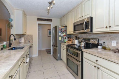 This charming home sits pretty on an oversized lot with stunning on Eagle Wood Golf Course in Florida - for sale on GolfHomes.com, golf home, golf lot