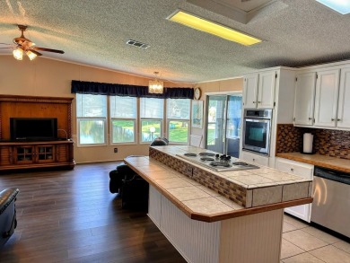Welcome to Paradise! Paradise island is a 55+ active community on Fairway Village Golf Course in Florida - for sale on GolfHomes.com, golf home, golf lot