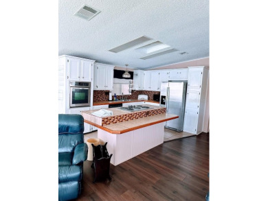 Welcome to Paradise! Paradise island is a 55+ active community on Fairway Village Golf Course in Florida - for sale on GolfHomes.com, golf home, golf lot