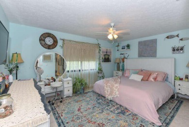 This charming home sits pretty on an oversized lot with stunning on Eagle Wood Golf Course in Florida - for sale on GolfHomes.com, golf home, golf lot