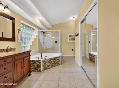 LAKEFRONT fountain views set the tone for this exceptional POOL on Plantation Bay Golf and Country Club in Florida - for sale on GolfHomes.com, golf home, golf lot