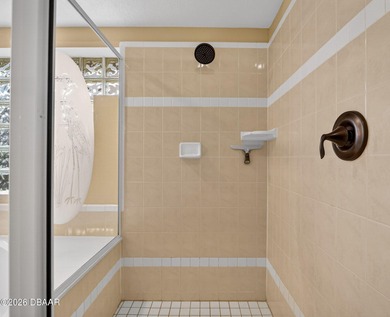 LAKEFRONT fountain views set the tone for this exceptional POOL on Plantation Bay Golf and Country Club in Florida - for sale on GolfHomes.com, golf home, golf lot