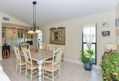 This charming home sits pretty on an oversized lot with stunning on Eagle Wood Golf Course in Florida - for sale on GolfHomes.com, golf home, golf lot