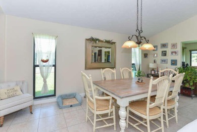 This charming home sits pretty on an oversized lot with stunning on Eagle Wood Golf Course in Florida - for sale on GolfHomes.com, golf home, golf lot