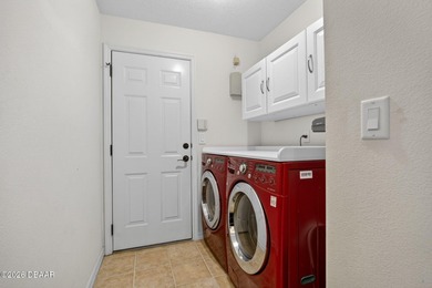 LAKEFRONT fountain views set the tone for this exceptional POOL on Plantation Bay Golf and Country Club in Florida - for sale on GolfHomes.com, golf home, golf lot