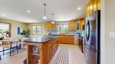 Discover the space and comfort of this phenomenal walk-out ranch on River Valley Golf Course in Iowa - for sale on GolfHomes.com, golf home, golf lot