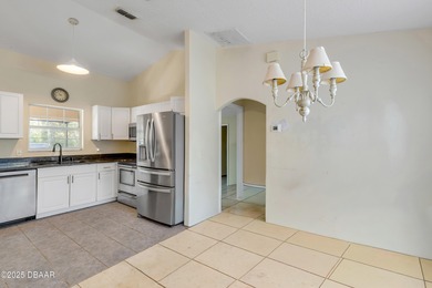 Welcome to this charming 3-bedroom, 2-bathroom home in Palm on The Grand Club Cypress Course in Florida - for sale on GolfHomes.com, golf home, golf lot