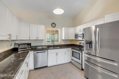 Welcome to this charming 3-bedroom, 2-bathroom home in Palm on The Grand Club Cypress Course in Florida - for sale on GolfHomes.com, golf home, golf lot