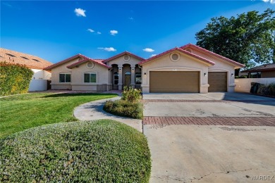 ***This gorgeous home backs up to the 7th hole of Cerbat Cliffs on Cerbat Cliffs Golf Course in Arizona - for sale on GolfHomes.com, golf home, golf lot