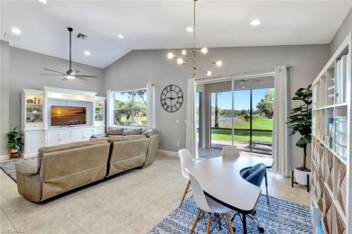 Enjoy sparkling lake and serene golf course views in this on Valencia Golf and Country Club in Florida - for sale on GolfHomes.com, golf home, golf lot