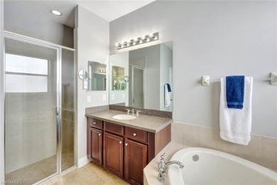 Enjoy sparkling lake and serene golf course views in this on Valencia Golf and Country Club in Florida - for sale on GolfHomes.com, golf home, golf lot