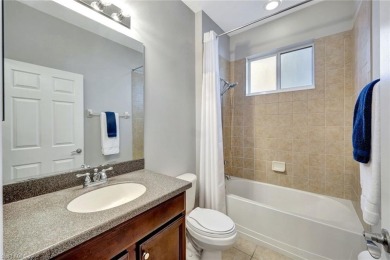 Enjoy sparkling lake and serene golf course views in this on Valencia Golf and Country Club in Florida - for sale on GolfHomes.com, golf home, golf lot