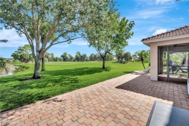 Enjoy sparkling lake and serene golf course views in this on Valencia Golf and Country Club in Florida - for sale on GolfHomes.com, golf home, golf lot