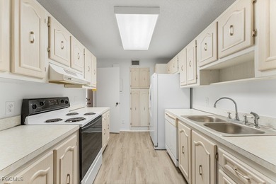 Step inside this classic Naples condo situated on The Hibiscus on Hibiscus Golf Club in Florida - for sale on GolfHomes.com, golf home, golf lot