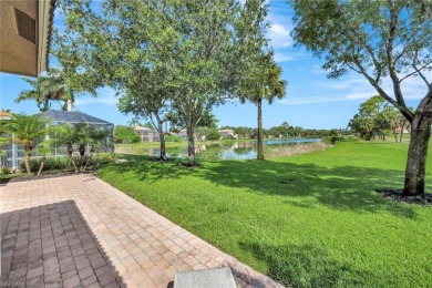 Enjoy sparkling lake and serene golf course views in this on Valencia Golf and Country Club in Florida - for sale on GolfHomes.com, golf home, golf lot
