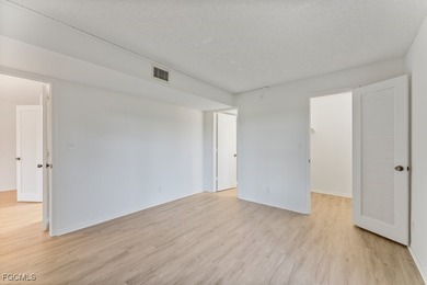 Step inside this classic Naples condo situated on The Hibiscus on Hibiscus Golf Club in Florida - for sale on GolfHomes.com, golf home, golf lot