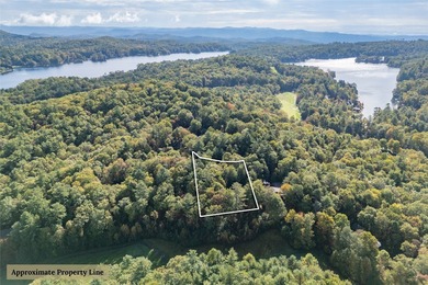 Perfectly positioned along the 18th fairway of Lake Toxaway's on Lake Toxaway Country Club in North Carolina - for sale on GolfHomes.com, golf home, golf lot