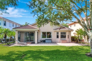 Enjoy sparkling lake and serene golf course views in this on Valencia Golf and Country Club in Florida - for sale on GolfHomes.com, golf home, golf lot