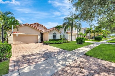 Enjoy sparkling lake and serene golf course views in this on Valencia Golf and Country Club in Florida - for sale on GolfHomes.com, golf home, golf lot