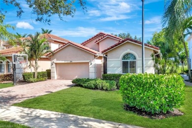 Enjoy sparkling lake and serene golf course views in this on Valencia Golf and Country Club in Florida - for sale on GolfHomes.com, golf home, golf lot