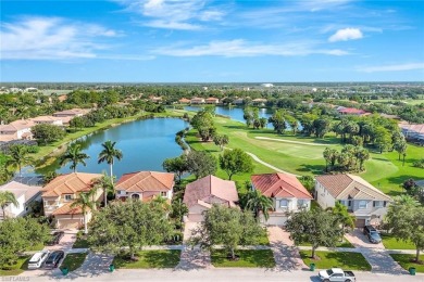 Enjoy sparkling lake and serene golf course views in this on Valencia Golf and Country Club in Florida - for sale on GolfHomes.com, golf home, golf lot