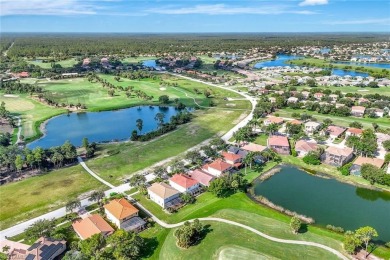 Enjoy sparkling lake and serene golf course views in this on Valencia Golf and Country Club in Florida - for sale on GolfHomes.com, golf home, golf lot