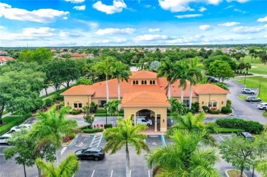Enjoy sparkling lake and serene golf course views in this on Valencia Golf and Country Club in Florida - for sale on GolfHomes.com, golf home, golf lot