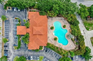Enjoy sparkling lake and serene golf course views in this on Valencia Golf and Country Club in Florida - for sale on GolfHomes.com, golf home, golf lot