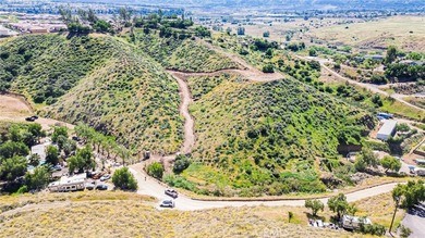 Perched atop a scenic hillside in the highly desirable Temescal on Glen Ivy Golf Club in California - for sale on GolfHomes.com, golf home, golf lot