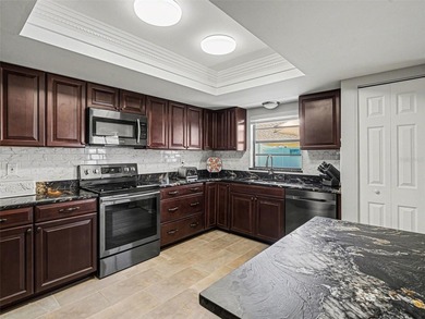 Under contract-accepting backup offers. Beautiful move-in ready on Caloosa Greens Executive Golf Course in Florida - for sale on GolfHomes.com, golf home, golf lot