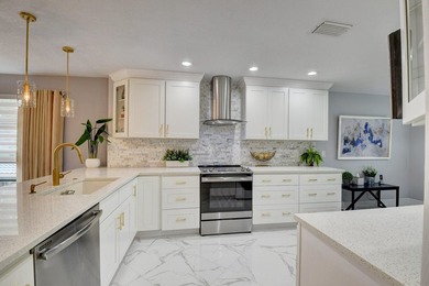 Welcome to Hunters Run Country Club! This spacious 2-bedroom on Hunters Run Golf and Country Club in Florida - for sale on GolfHomes.com, golf home, golf lot