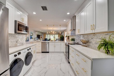 Welcome to Hunters Run Country Club! This spacious 2-bedroom on Hunters Run Golf and Country Club in Florida - for sale on GolfHomes.com, golf home, golf lot