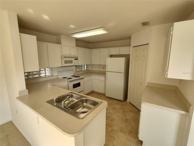 Charming Coventry model ready for new owners! This home features on Royal Oaks Golf Club in Florida - for sale on GolfHomes.com, golf home, golf lot