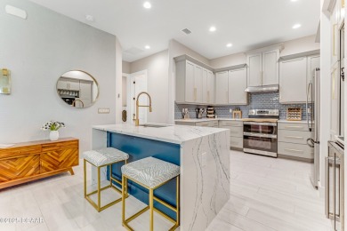 This exclusive four-bedroom townhome in the gated Plantation Bay on Plantation Bay Golf and Country Club in Florida - for sale on GolfHomes.com, golf home, golf lot