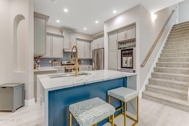 This exclusive four-bedroom townhome in the gated Plantation Bay on Plantation Bay Golf and Country Club in Florida - for sale on GolfHomes.com, golf home, golf lot