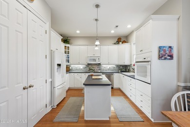 Discover the exceptional lifestyle at 627 Wild Dunes Circle on Porters Neck Country Club in North Carolina - for sale on GolfHomes.com, golf home, golf lot