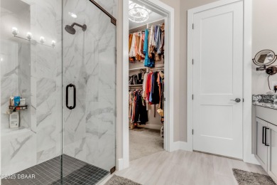 This exclusive four-bedroom townhome in the gated Plantation Bay on Plantation Bay Golf and Country Club in Florida - for sale on GolfHomes.com, golf home, golf lot