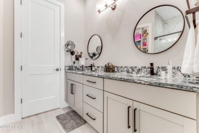 This exclusive four-bedroom townhome in the gated Plantation Bay on Plantation Bay Golf and Country Club in Florida - for sale on GolfHomes.com, golf home, golf lot