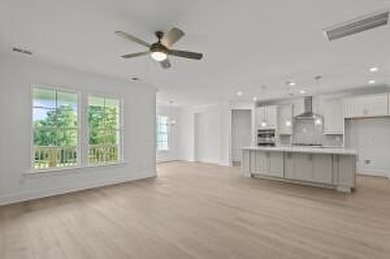 Discover Southern elegance in this exquisite Wescott Elevation A on Woodside Plantation Country Club in South Carolina - for sale on GolfHomes.com, golf home, golf lot