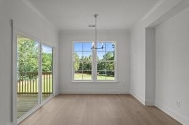 Discover Southern elegance in this exquisite Wescott Elevation A on Woodside Plantation Country Club in South Carolina - for sale on GolfHomes.com, golf home, golf lot