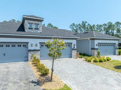 This exclusive four-bedroom townhome in the gated Plantation Bay on Plantation Bay Golf and Country Club in Florida - for sale on GolfHomes.com, golf home, golf lot