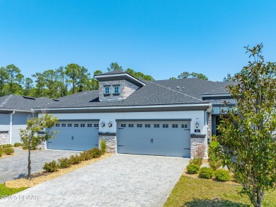 This exclusive four-bedroom townhome in the gated Plantation Bay on Plantation Bay Golf and Country Club in Florida - for sale on GolfHomes.com, golf home, golf lot