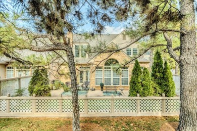 Perched on a beautiful tree-lined street in gated The Highlands on Oak Tree National Golf and Country Club in Oklahoma - for sale on GolfHomes.com, golf home, golf lot