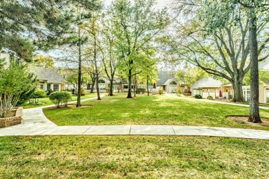 Perched on a beautiful tree-lined street in gated The Highlands on Oak Tree National Golf and Country Club in Oklahoma - for sale on GolfHomes.com, golf home, golf lot