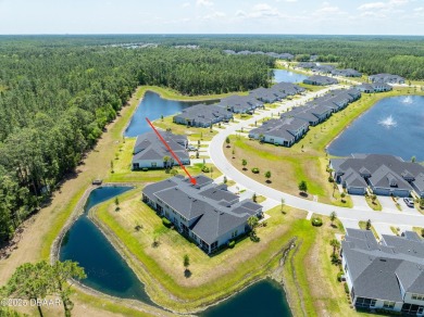 This exclusive four-bedroom townhome in the gated Plantation Bay on Plantation Bay Golf and Country Club in Florida - for sale on GolfHomes.com, golf home, golf lot