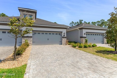 This exclusive four-bedroom townhome in the gated Plantation Bay on Plantation Bay Golf and Country Club in Florida - for sale on GolfHomes.com, golf home, golf lot
