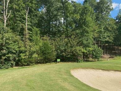 This lot has a near level building area located on a rise given on Ponce De Leon Golf Course in Arkansas - for sale on GolfHomes.com, golf home, golf lot