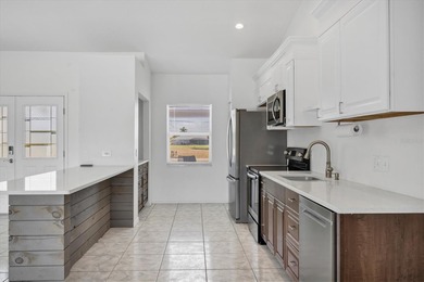 Unique opportunity to own a triplex featuring a spacious on Rotonda Golf and Country Club The Palms Course in Florida - for sale on GolfHomes.com, golf home, golf lot